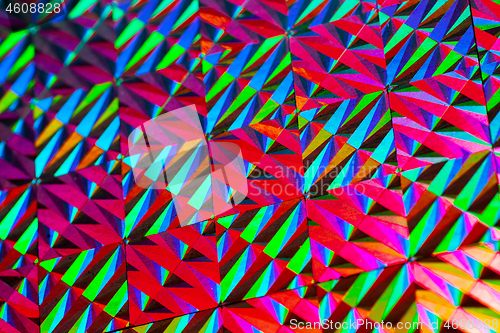 Image of Texture of red foil with holographic effect. Christmas background.