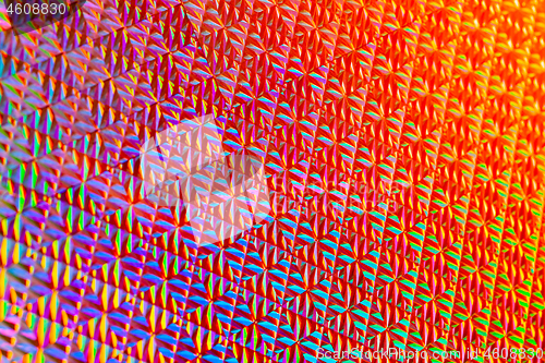 Image of Texture of red foil with holographic effect. Christmas background.