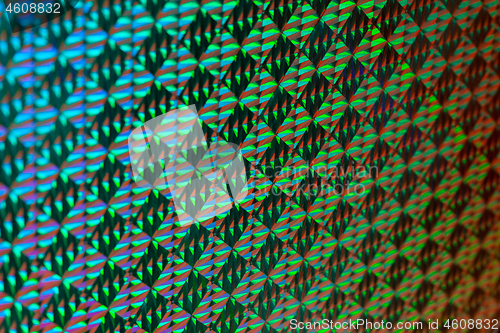 Image of Texture of red foil with holographic effect. Christmas background.