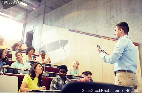 Image of students and teacher with tablet pc at lecture