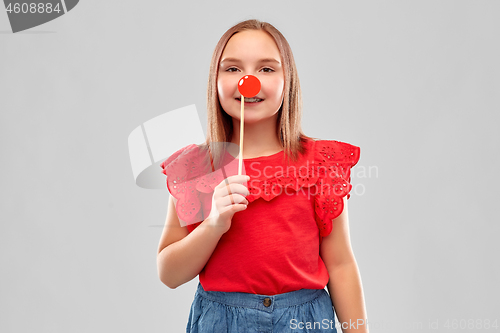 Image of beautiful smiling girl in red shirt and skirt