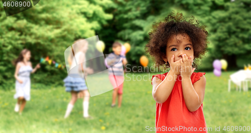 Image of confused african american girl at birhtday party