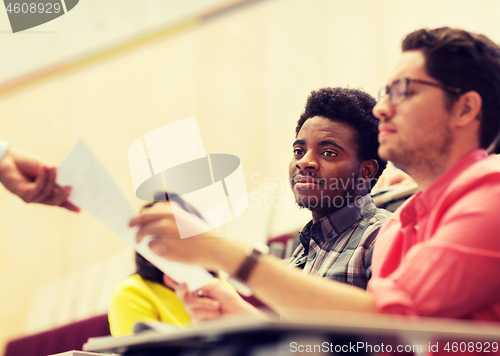 Image of international students with test on lecture