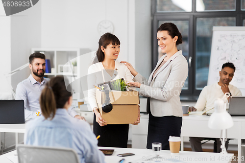 Image of new female employee meeting colleagues at office