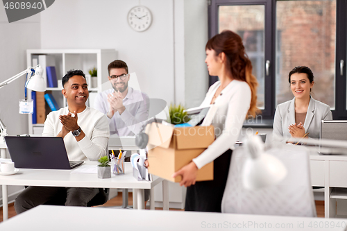 Image of colleagues applauding to new female office worker