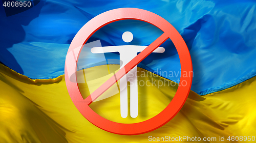 Image of Warning sign with crossed out man on a background of Ukrainian flag.