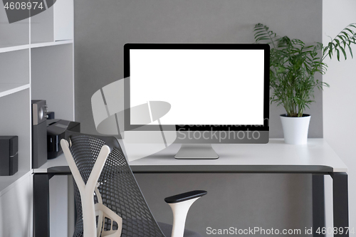 Image of Modern office working space with mock up computer screen.