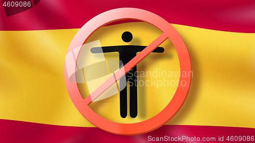 Image of Forbbiden sign with crossed out man on a background Spanish flag.