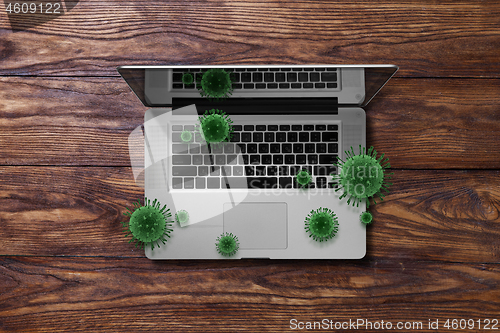 Image of Notebook with flying bacteria of Coronavirus.