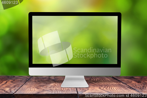 Image of Monitor with blurred screen and background.