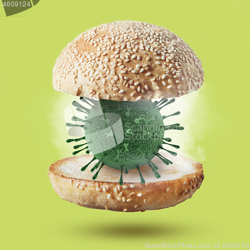 Image of Burger bun with 3D model of Coronavirus molecule.