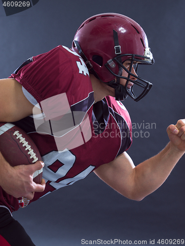 Image of American football Player running with the ball