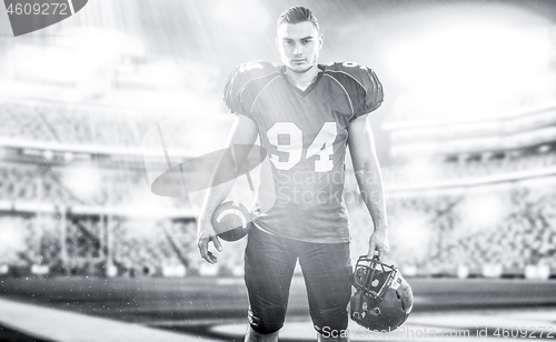 Image of American Football Player isolated on big modern stadium field