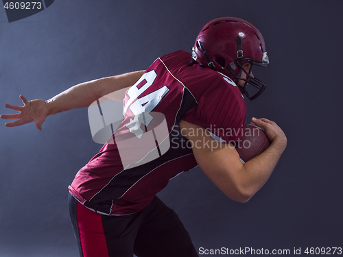 Image of American football Player running with the ball