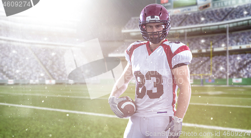 Image of American Football Player isolated on big modern stadium field