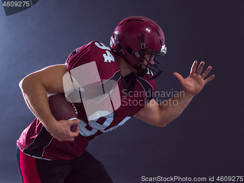 Image of American football Player running with the ball