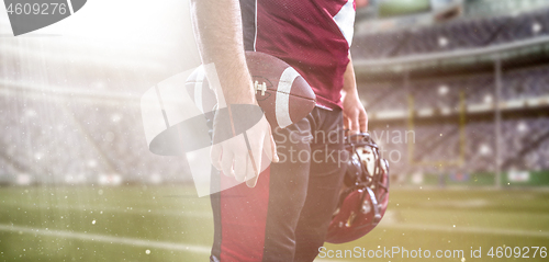 Image of closeup American Football Player isolated on big modern stadium