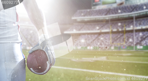 Image of closeup American Football Player isolated on big modern stadium