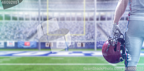 Image of closeup American Football Player isolated on big modern stadium