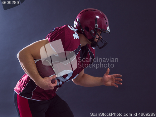 Image of American football Player running with the ball