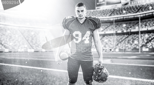 Image of American Football Player isolated on big modern stadium field