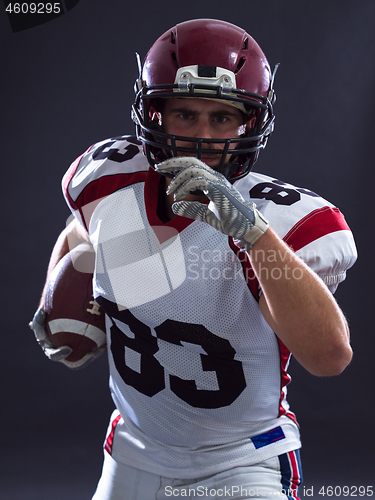 Image of American football Player running with the ball