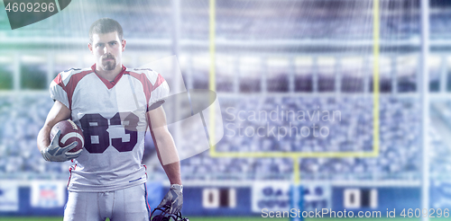 Image of American Football Player isolated on big modern stadium field