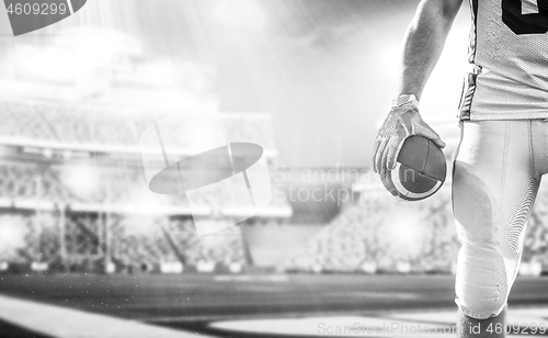 Image of closeup American Football Player isolated on big modern stadium