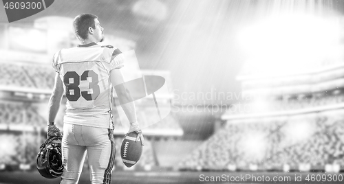 Image of American Football Player isolated on big modern stadium field