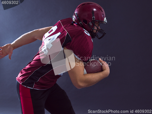 Image of American football Player running with the ball