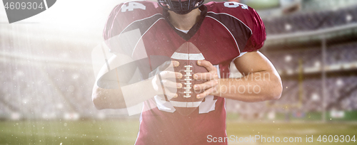 Image of closeup American Football Player isolated on big modern stadium