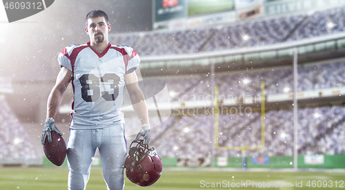 Image of American Football Player isolated on big modern stadium field