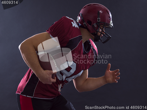 Image of American football Player running with the ball