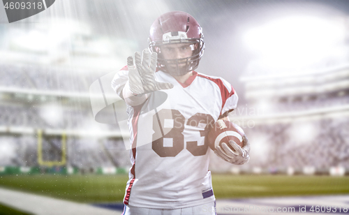 Image of portrait of confident American football player