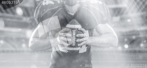 Image of closeup American Football Player isolated on big modern stadium