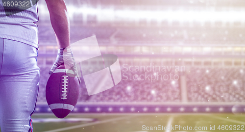 Image of closeup American Football Player isolated on big modern stadium