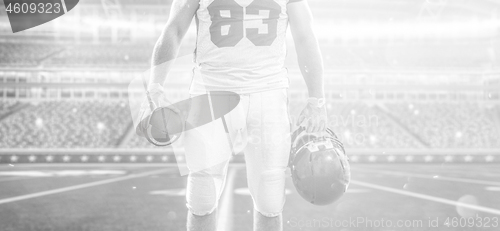 Image of closeup American Football Player isolated on big modern stadium