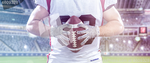 Image of closeup American Football Player isolated on big modern stadium