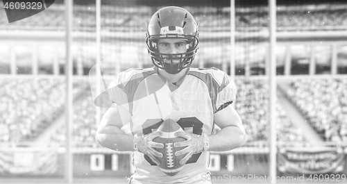 Image of American Football Player isolated on big modern stadium field