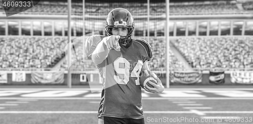 Image of portrait of confident American football player