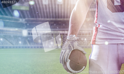 Image of closeup American Football Player isolated on big modern stadium