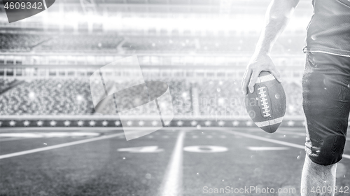 Image of closeup American Football Player isolated on big modern stadium