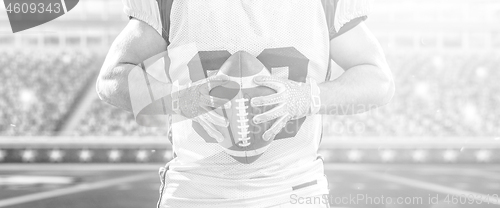 Image of closeup American Football Player isolated on big modern stadium