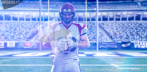 Image of American Football Player isolated on big modern stadium field