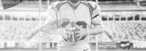 Image of closeup American Football Player isolated on big modern stadium