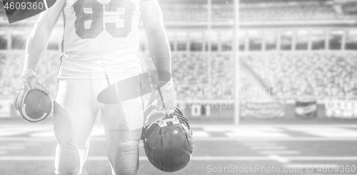 Image of closeup American Football Player isolated on big modern stadium