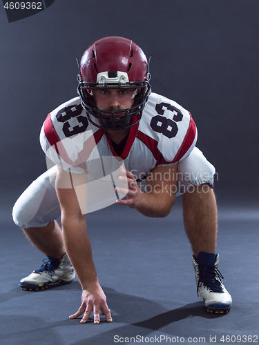 Image of American football player getting ready before starting