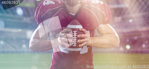 Image of closeup American Football Player isolated on big modern stadium