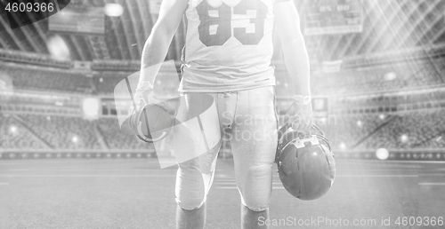 Image of closeup American Football Player isolated on big modern stadium