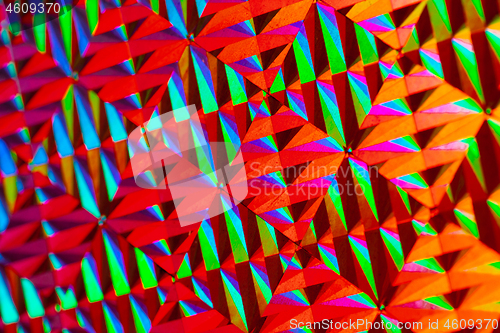 Image of Texture of red foil with holographic effect. Christmas background.